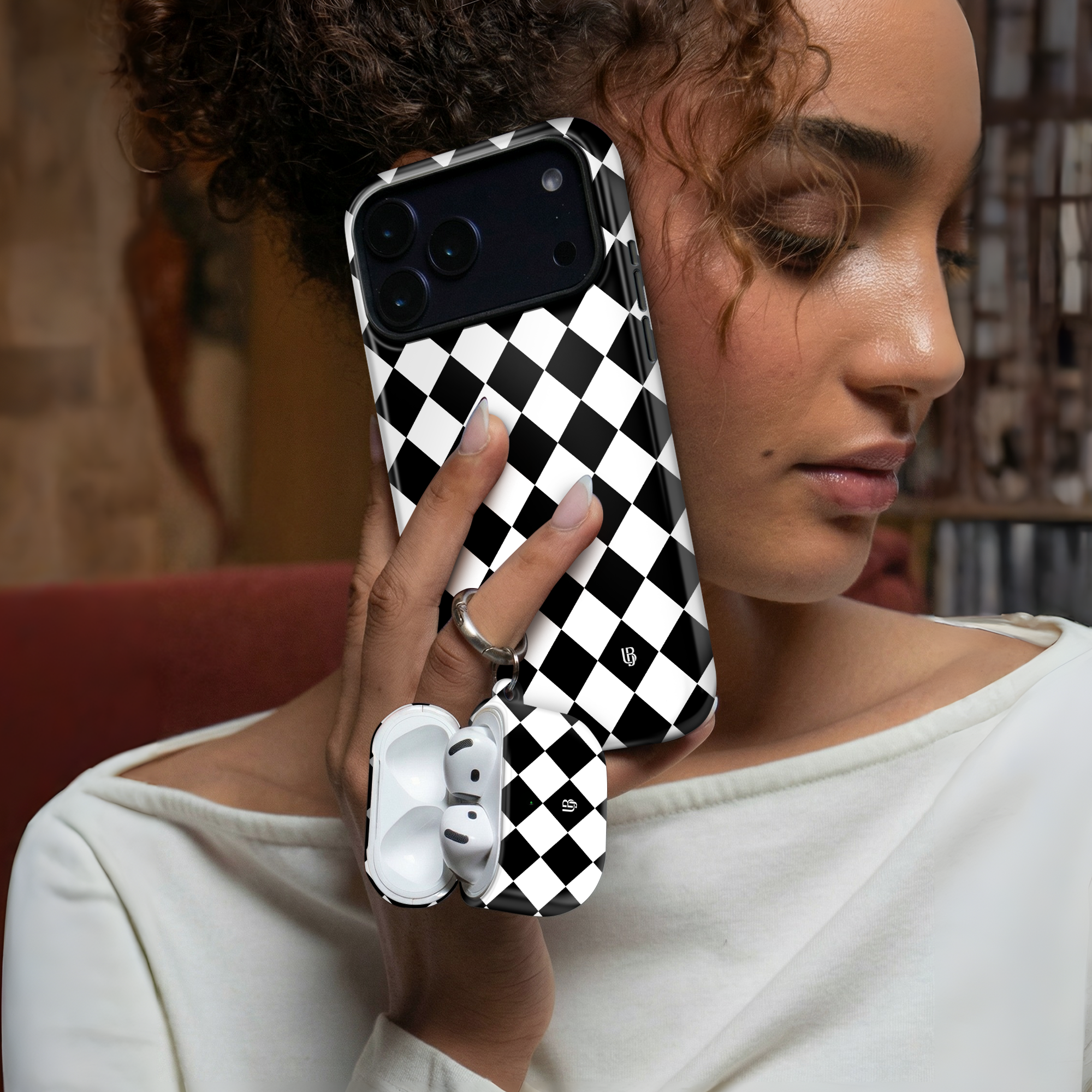 Harlequin Noir Ultrabling AirPods case detail view